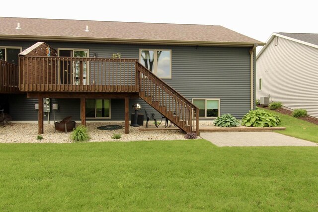 2253 Walnut St, Beloit, WI 53511 - rear view of property with a yard, a wooden deck, and stairway