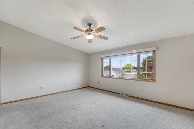 10380 W Whitnall Edge Cir Unit F, Franklin, WI 53132 - empty room featuring light colored carpet, ceiling fan, baseboards, and vaulted ceiling