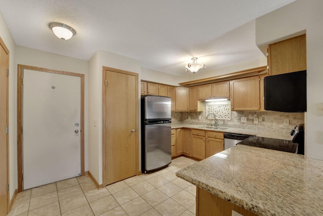 10380 W Whitnall Edge Cir Unit F, Franklin, WI 53132 - kitchen with stainless steel appliances, a sink, backsplash, and light tile patterned floors