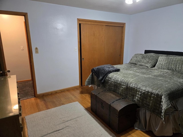 4817 Morgan Dr, Manitowoc, WI 54220 - bedroom featuring wood finished floors, a closet, and baseboards