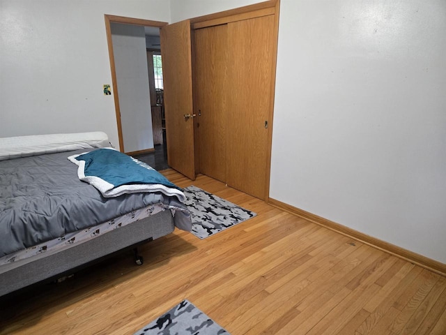 4817 Morgan Dr, Manitowoc, WI 54220 - bedroom featuring light wood-type flooring, baseboards, and a closet
