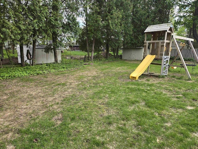 4817 Morgan Dr, Manitowoc, WI 54220 - view of green lawn featuring a playground