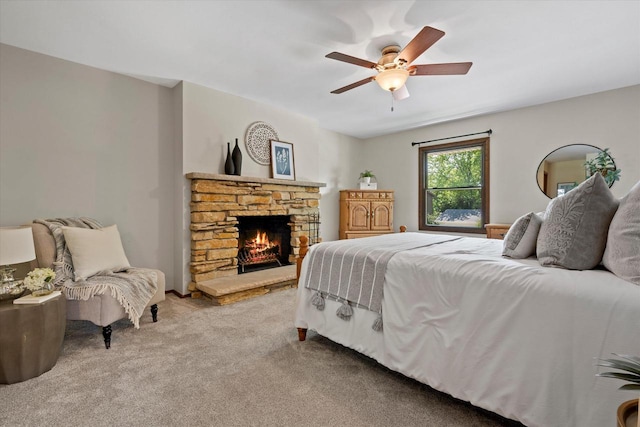 2824 Minot Ln, Waukesha, WI 53188 - bedroom featuring light carpet, a stone fireplace, and ceiling fan
