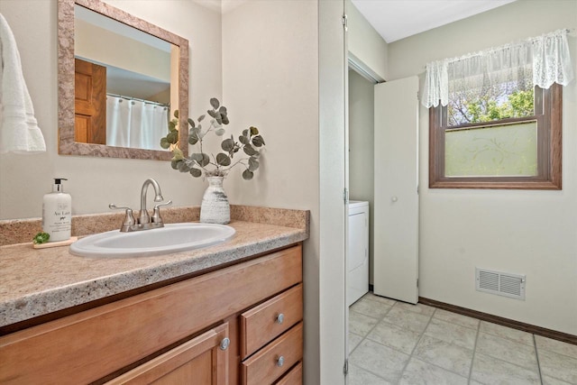 2824 Minot Ln, Waukesha, WI 53188 - bathroom with vanity, washer / clothes dryer, and baseboards