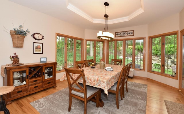 9111 400th Ct, Genoa City, WI 53128 - dining room with crown molding, light wood-style flooring, a raised ceiling, baseboards, and a chandelier