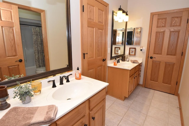 9111 400th Ct, Genoa City, WI 53128 - bathroom with two vanities, tile patterned floors, shower / bath combo with shower curtain, and toilet