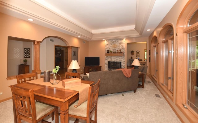 9111 400th Ct, Genoa City, WI 53128 - dining room with a tray ceiling, a fireplace, light carpet, recessed lighting, and ornate columns