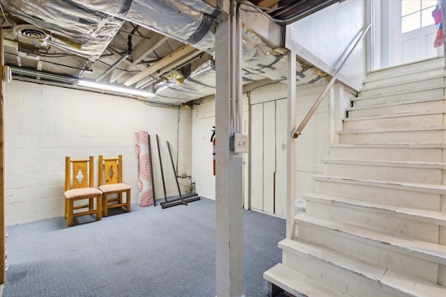 947 Cleveland St, Beloit, WI 53511 - below grade area featuring stairway and carpet floors