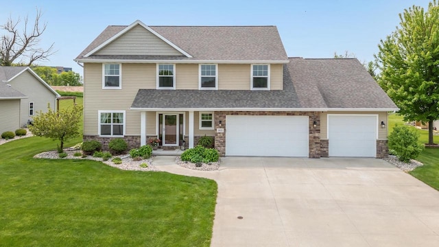 905 W Hubble Ln, Appleton, WI 54913 - view of front of property with stone siding, driveway, a front yard, and an attached garage