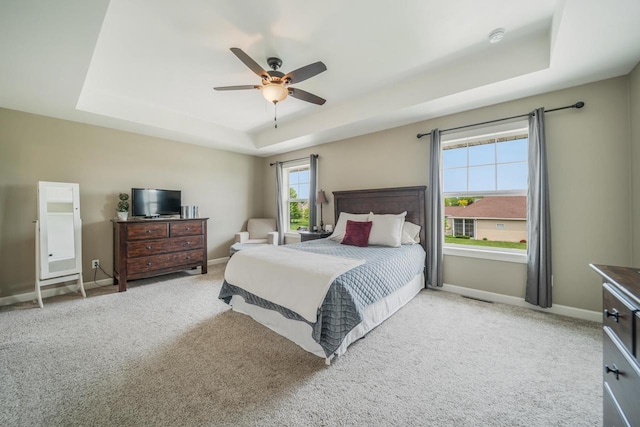 905 W Hubble Ln, Appleton, WI 54913 - carpeted bedroom with a raised ceiling, baseboards, and ceiling fan