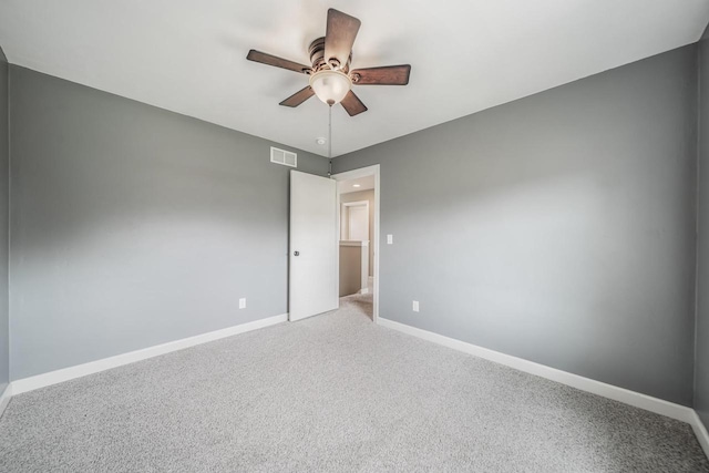 905 W Hubble Ln, Appleton, WI 54913 - spare room featuring a ceiling fan, baseboards, and carpet flooring