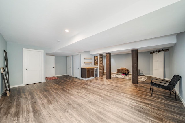 905 W Hubble Ln, Appleton, WI 54913 - unfurnished living room featuring baseboards, wood finished floors, recessed lighting, and beverage cooler