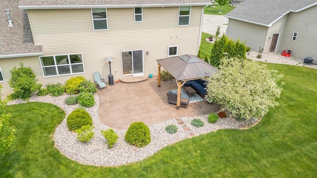 905 W Hubble Ln, Appleton, WI 54913 - back of property with a gazebo, roof with shingles, a patio, and a lawn