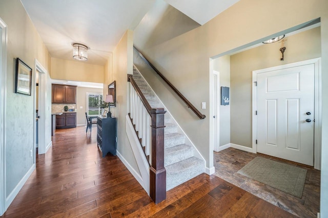 905 W Hubble Ln, Appleton, WI 54913 - foyer entrance featuring dark wood finished floors, stairs, and baseboards