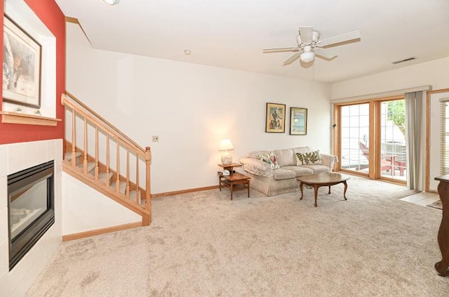 2425 Fox River Pkwy Unit H, Waukesha, WI 53189 - carpeted living area with a ceiling fan, a glass covered fireplace, and stairs