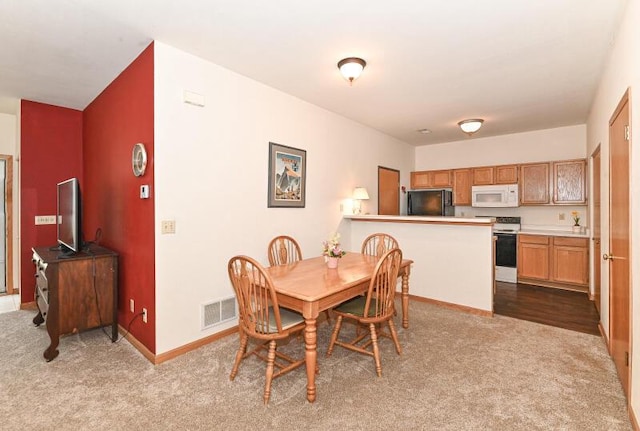 2425 Fox River Pkwy Unit H, Waukesha, WI 53189 - dining space with carpet floors and baseboards