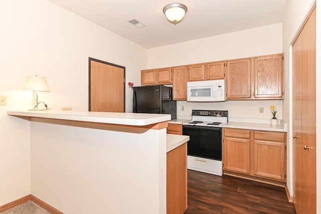 2425 Fox River Pkwy Unit H, Waukesha, WI 53189 - kitchen with white appliances, light countertops, a peninsula, dark wood-type flooring, and baseboards