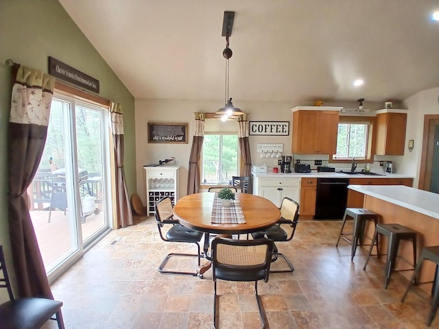 N9827 Abbey Rd, Crivitz, WI 54114 - dining space featuring healthy amount of natural light, light stone finish flooring, vaulted ceiling, and recessed lighting