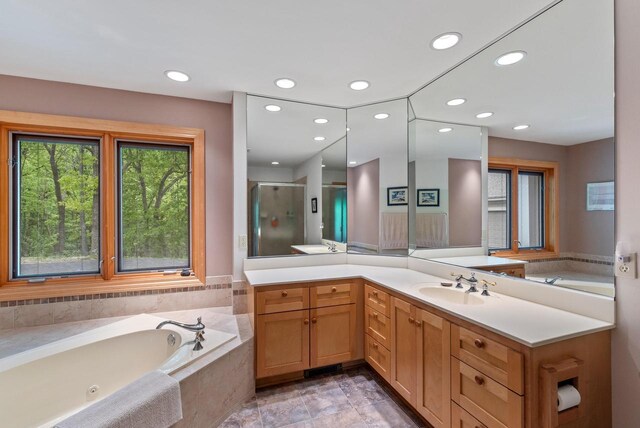 W3847 Timber Lake Rd, East Troy, WI 53120 - bathroom with vanity, a shower stall, a garden tub, and recessed lighting