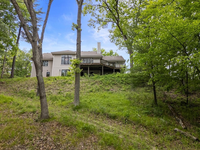 W3847 Timber Lake Rd, East Troy, WI 53120 - rear view of property featuring a chimney and a wooden deck