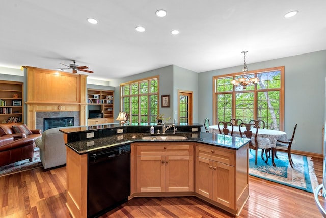 W3847 Timber Lake Rd, East Troy, WI 53120 - kitchen featuring dishwasher, a sink, a center island with sink, a chandelier, and open floor plan