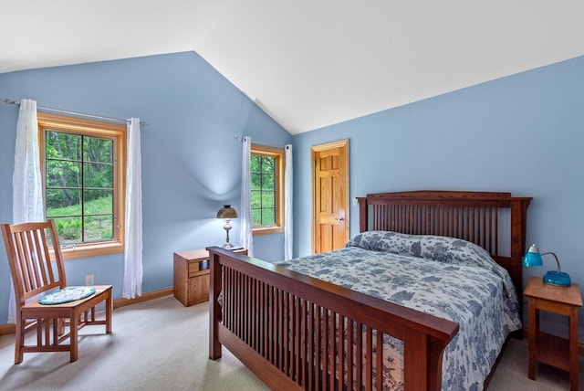 W3847 Timber Lake Rd, East Troy, WI 53120 - bedroom with lofted ceiling, light carpet, and baseboards