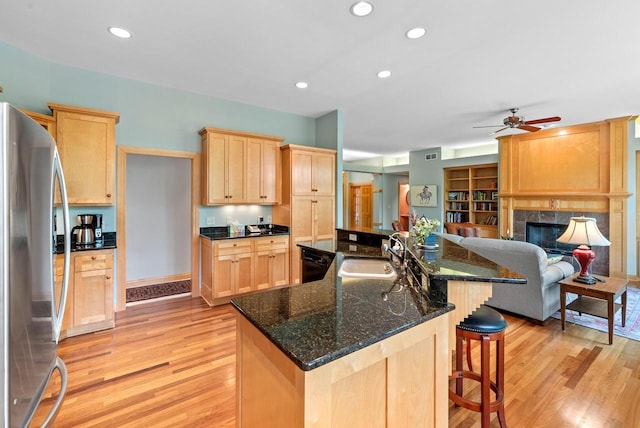 W3847 Timber Lake Rd, East Troy, WI 53120 - kitchen featuring freestanding refrigerator, light brown cabinets, a sink, light wood-style flooring, and recessed lighting