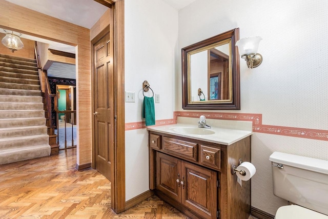 28 W Lake Rd, Menasha, WI 54952 - bathroom with wallpapered walls, vanity, and toilet