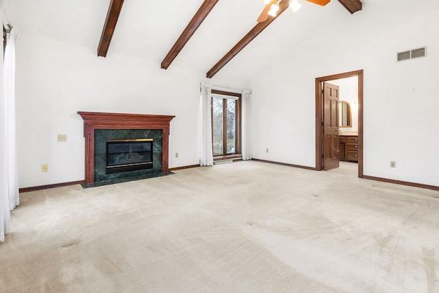 28 W Lake Rd, Menasha, WI 54952 - unfurnished living room with a ceiling fan, beam ceiling, a fireplace, baseboards, and carpet floors