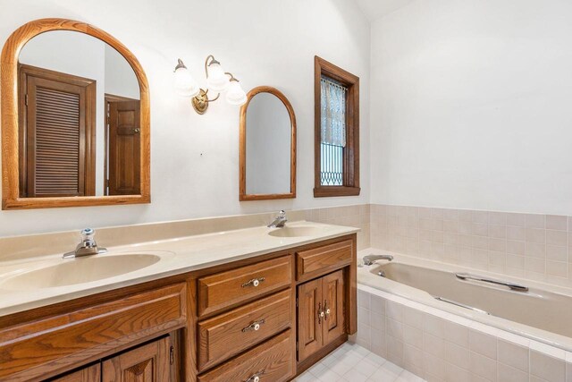 28 W Lake Rd, Menasha, WI 54952 - bathroom featuring double vanity, a bath, and tile patterned floors