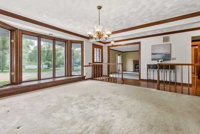 28 W Lake Rd, Menasha, WI 54952 - carpeted empty room featuring ornamental molding and a chandelier