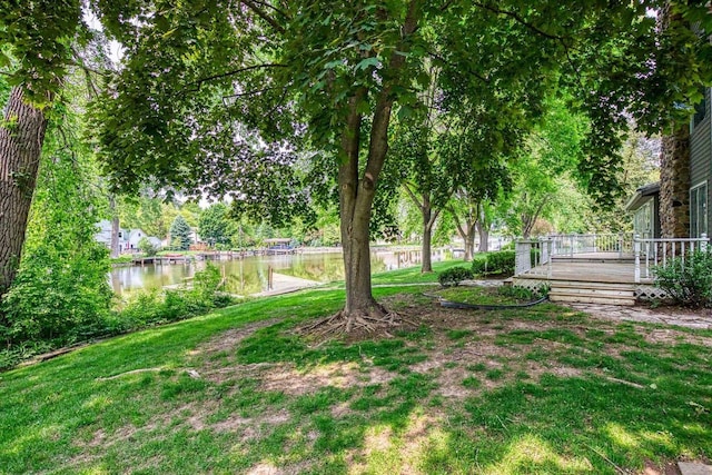 28 W Lake Rd, Menasha, WI 54952 - view of green lawn with a deck with water view