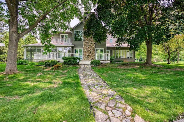28 W Lake Rd, Menasha, WI 54952 - view of front of home featuring a balcony and a front lawn
