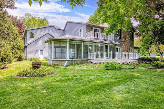 28 W Lake Rd, Menasha, WI 54952 - back of house with a balcony, a sunroom, and a lawn