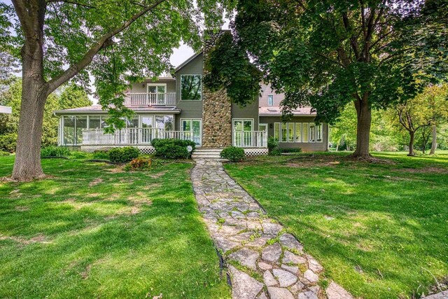 28 W Lake Rd, Menasha, WI 54952 - view of front of home featuring a balcony and a front lawn