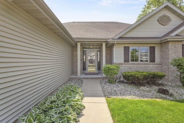 1323 Bradford Ct, Neenah, WI 54956 - doorway to property featuring brick siding and roof with shingles