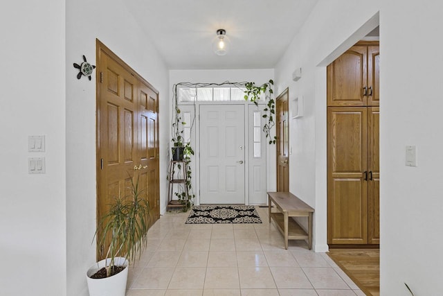 1323 Bradford Ct, Neenah, WI 54956 - entryway featuring light tile patterned flooring and baseboards
