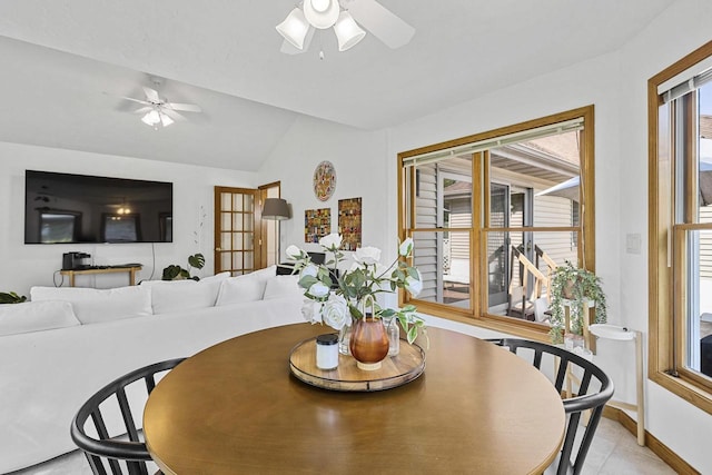 1323 Bradford Ct, Neenah, WI 54956 - dining space featuring ceiling fan, vaulted ceiling, and baseboards