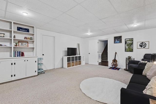 1323 Bradford Ct, Neenah, WI 54956 - living area featuring carpet flooring, stairs, a paneled ceiling, and baseboards