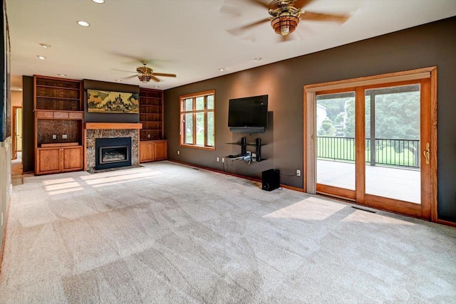 2040 Continental Ln, Cross Plains, WI 53528 - unfurnished living room with ceiling fan, light carpet, a fireplace with flush hearth, and recessed lighting