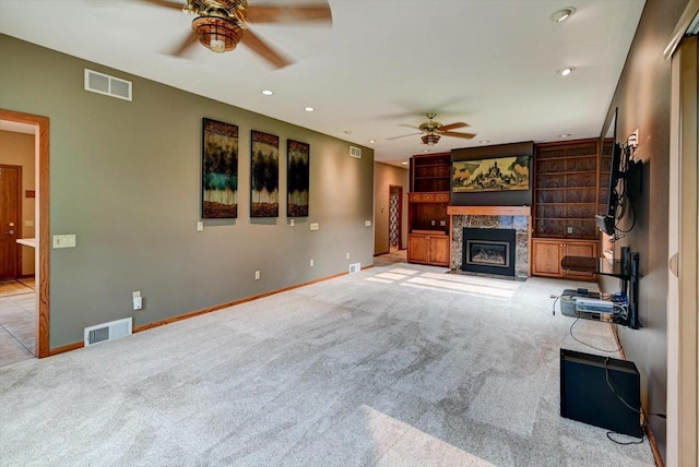 2040 Continental Ln, Cross Plains, WI 53528 - unfurnished living room with a ceiling fan, carpet flooring, a fireplace, and recessed lighting