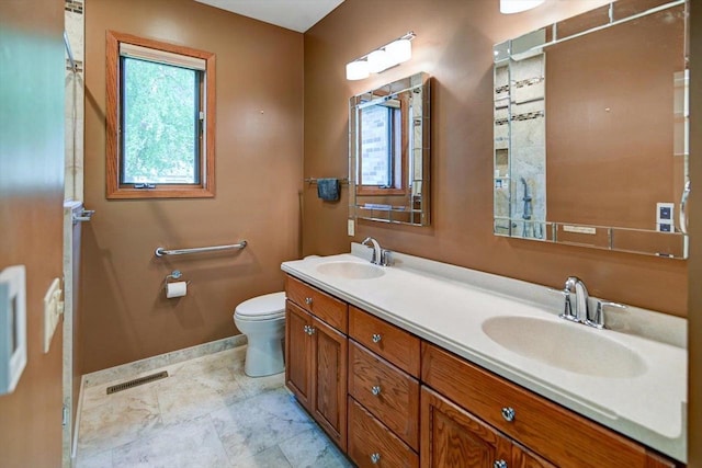 2040 Continental Ln, Cross Plains, WI 53528 - full bathroom featuring toilet and double vanity
