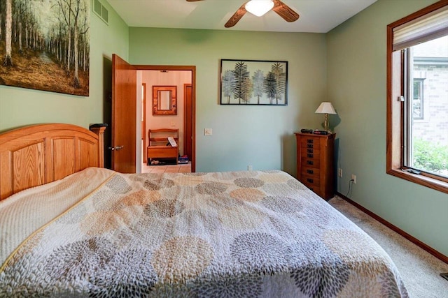 2040 Continental Ln, Cross Plains, WI 53528 - carpeted bedroom with multiple windows and a ceiling fan