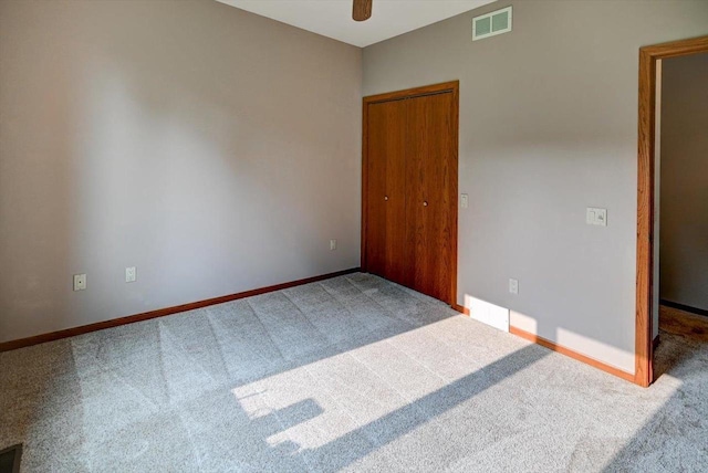 2040 Continental Ln, Cross Plains, WI 53528 - unfurnished bedroom with carpet, a closet, and a ceiling fan