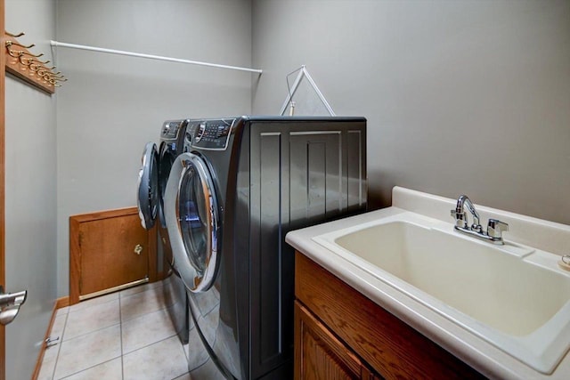 2040 Continental Ln, Cross Plains, WI 53528 - laundry room with independent washer and dryer and light tile patterned floors