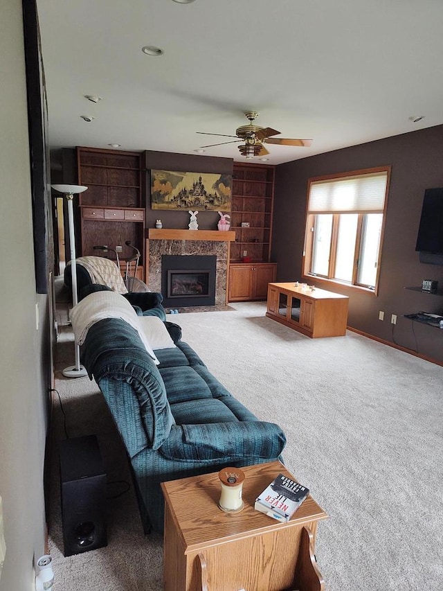 2040 Continental Ln, Cross Plains, WI 53528 - carpeted living room with a ceiling fan and a tiled fireplace