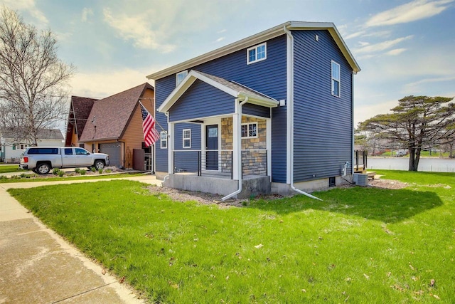 2320 Wilson St, Two Rivers, WI 54241 - view of front of property featuring covered porch, a front lawn, a garage, and central AC unit