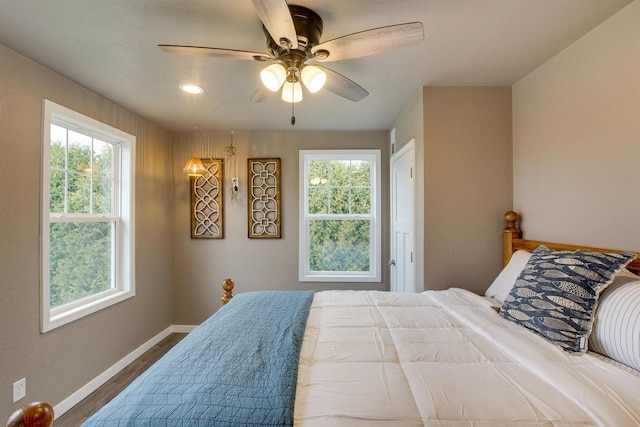 2320 Wilson St, Two Rivers, WI 54241 - bedroom featuring baseboards, dark wood-style floors, multiple windows, recessed lighting, and ceiling fan