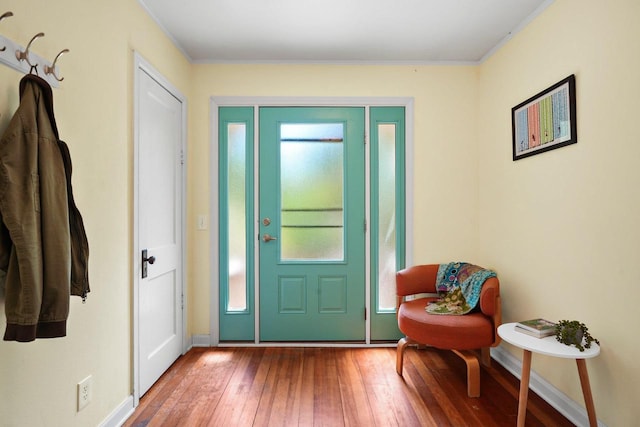 129 Division St, Madison, WI 53704 - entryway with hardwood / wood-style flooring and crown molding