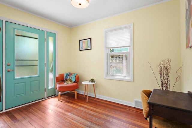 129 Division St, Madison, WI 53704 - entrance foyer featuring hardwood / wood-style floors and ornamental molding
